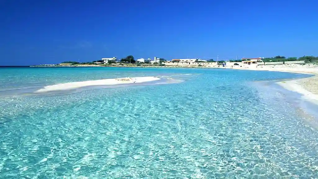 Punta Prosciutto is a beach with crystal-clear water that allows you to walk for many meters towards deeper waters.